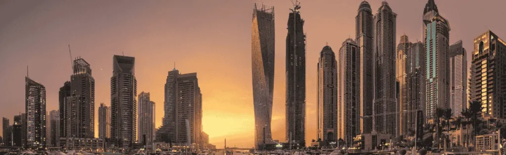 Panorama Dubaju, jednego z najważniejszych miast Zjednoczonych Emiratów Arabskich, kierunek wschód, język arabski